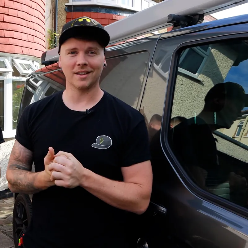 Nick Bundy standing by his van